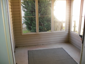 The screen-in porch prior to house purchase. Note the rug on the floor.